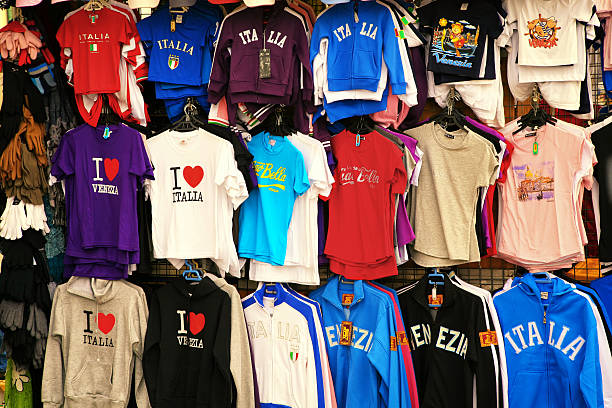 Venice, Italy - Nov. 7, 2009: Italy tourist t-shirts and other clothing displayed in an outdoor shop/stall on the waterfront of the Grand Canal in Venice, Italy.
