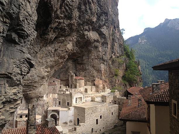 Sumela Monastery "Trabzon, Turkey - August 9, 2013: Tourists visit Sumela Monastery. Sumela is 1600 year old ancient Orthodox monastery. Photo taken from Trabzon City, Turkey. Photo taken with Apple iPhone." sumela monastery stock pictures, royalty-free photos & images