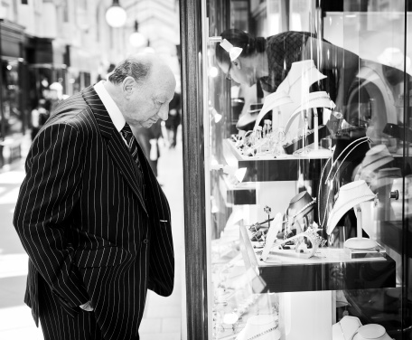 London, UK - May 4, 2011: British gentleman looking at jewelry in the Burlington Arcade