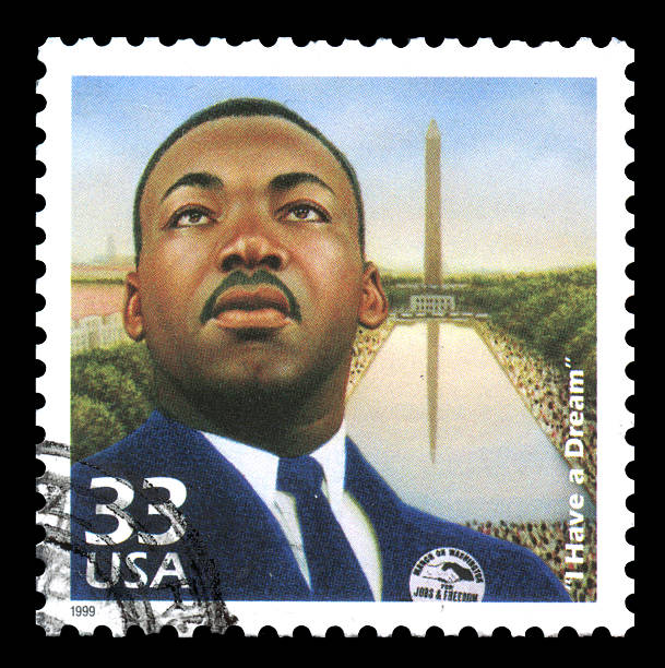 Martin Luther King USA Postage Stamp London, UK – January 15, 2012: USA postage stamp of 1999 showing an image of Martin Luther King with his famous quotation of \'I have a dream\' black civil rights stock pictures, royalty-free photos & images