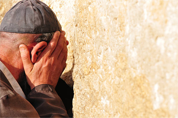 Jerusalem, Israel - May 15, 2015: Israeli Jewish men praying at the Western Wall in Jerusalem