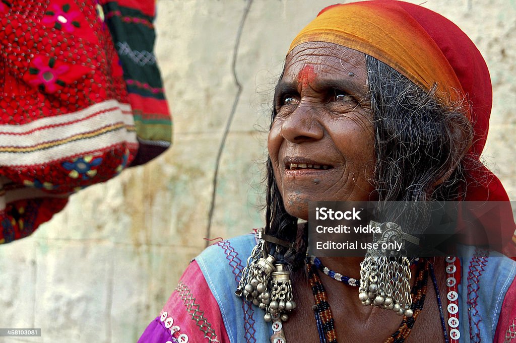 gypsy woman "Hampi, India - april 14, 2008: Old gypsy woman in traditional clothing selling handicrafts on streets of Hampi." Culture of India Stock Photo