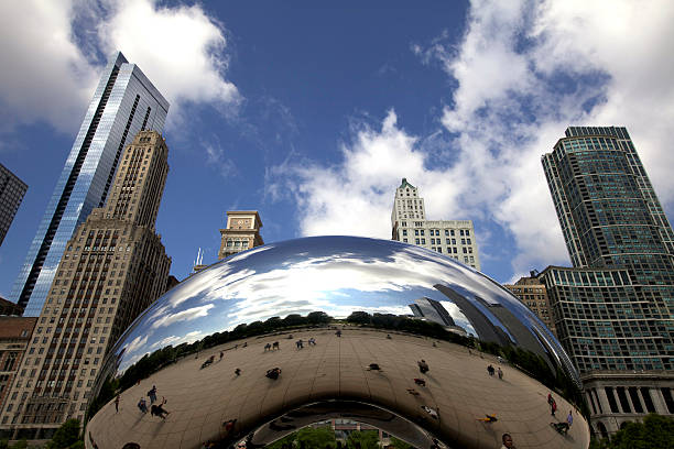 Cloud Gate, Chicago "Chicago, Illinois, USA, June 16, 2011. Clouds and pedestrians are reflected in Anish Kapoor\'s Cloud Gate, also known at The Bean." millennium park stock pictures, royalty-free photos & images