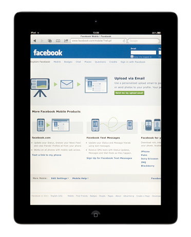 Seoul, Korea - April 29, 2011: Mobile Facebook website on digital tablet.(Apple iPad) It is isolated on white background.