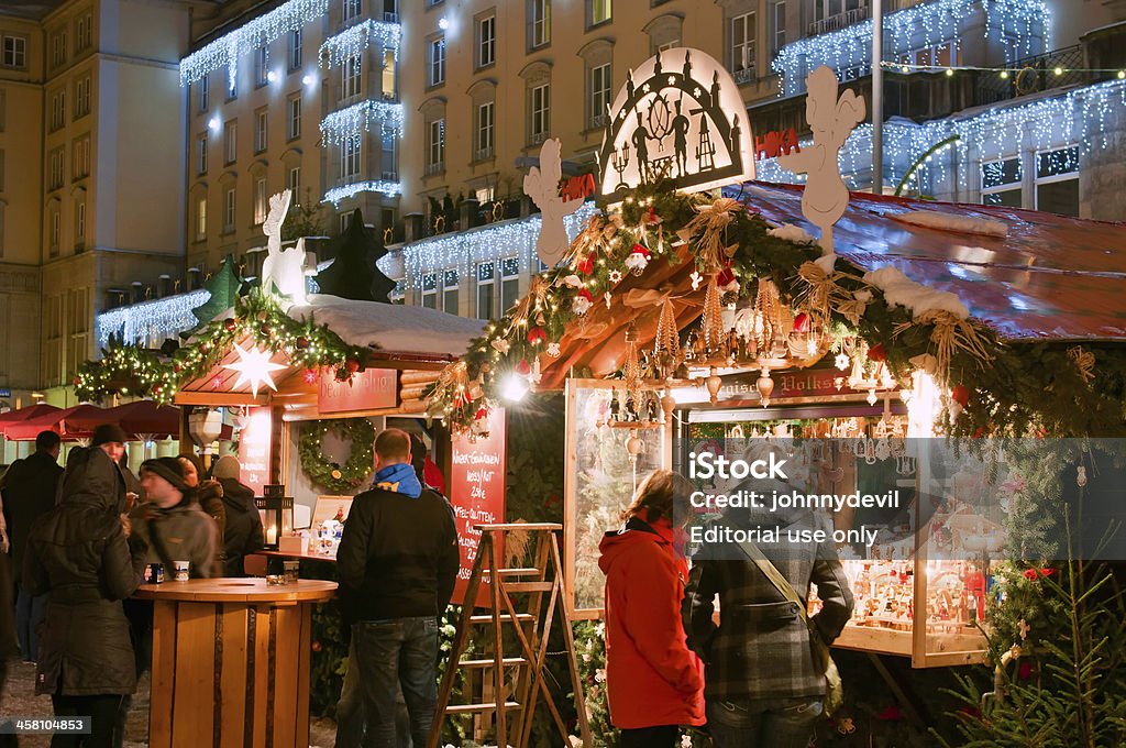 Christmas Market in Dresden "Dresden, Germany - December 20: People enjoy Christmas market in Dresden on December 20, 2010 in Dresden, Germany. It is Germany's oldest Christmas Market with a very long history dating back to 1434." Christmas Stock Photo