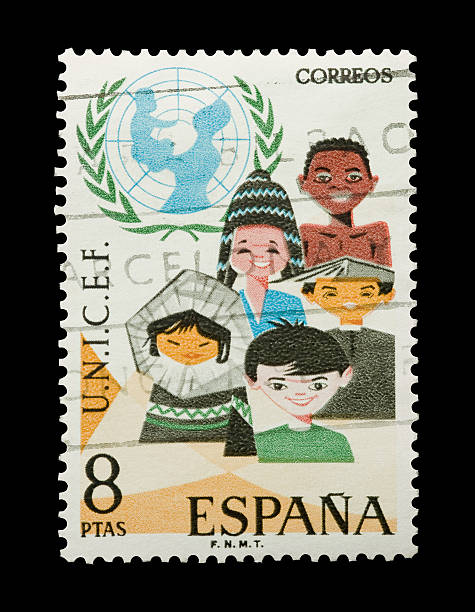 UNICEF "Yateley, Hampshire, United Kingdom - July 27, 2011: Mail stamp printed in Spain, circa 1971; celebrating the 25th anniversary of UNICEF, the United Nations International Children\'s Emergency Fund humanitarian aid organization." unicef vintage stock pictures, royalty-free photos & images