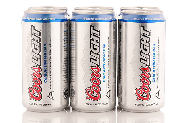 Six pack of Coors Light beer cans, 12 oz size "Frederick, MD, USA - February 22, 2011: Six pack of Coors Light beer cans, in 12 oz Cold Activated packaging with Wide Vented Mouth. The cans are not cold in this image, so the mountains on the packaging appear white rather than blue. Coors Light is produced by the Coors Brewing Company, it is a light beer." Can of Coors Light stock pictures, royalty-free photos & images