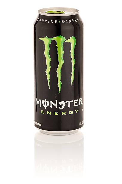Monster Energy Drink in 16 oz can with Reflection "Frederick, MD, USA - February 19, 2011: Product shot of Monster Energy drink, packaged in a 16 oz can. Monster energy contains Caffeine, Taurine, and Ginseng. Monster Energy is marketed and distributed by Hansen Natural Corporation. Studio product shot, isolated on white background, with glossy reflection." monster energy stock pictures, royalty-free photos & images