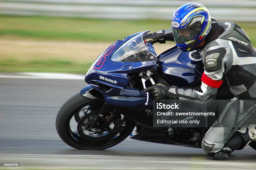 Superbike Poland, Poznan - July 30, 2007: A young man riding a motorcycle in expert level group, during the course of improving driving skills with motorcycle on the race track in Poznan.  Motorcycle Stock Photo