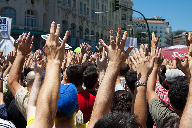 15M protesters in Madrid, Spain "Madrid, Spain - June 19, 2011:Thousands of protesters in demonstrations of the movement 15 in madrid" strike protest action photos stock pictures, royalty-free photos & images