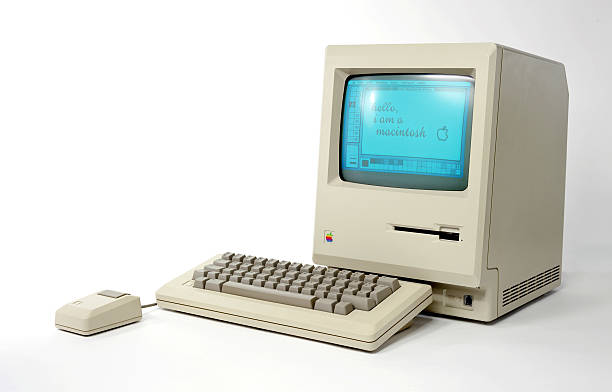 Side View of the Historic Macintosh 128k "Aachen, Germany - April 9th 2011: This is a photo taken in the studio on a white background of an Apple Macintosh 128k Computer. This one was the first mac ever, released in 1984 by Apple Computers Inc." ergonomic keyboard photos stock pictures, royalty-free photos & images