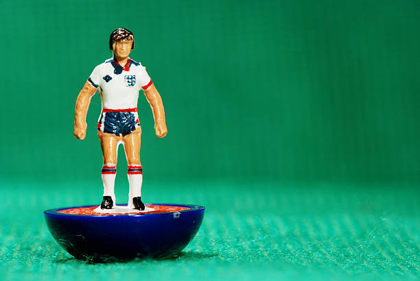 Vintage Subbuteo soccer player miniature toy Pila, Italy - May 26, 2011: Vintage Subbuteo miniature toy of a soccer player of the English national team. Subbuteo is a set of table top games simulating team sports such as soccer, cricket, rugby and hockey created by Peter Adolph. human representation photos stock pictures, royalty-free photos & images