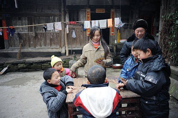 Chinese New Year, Chinese girl wearing ethnic minority costumes in an ancient village
