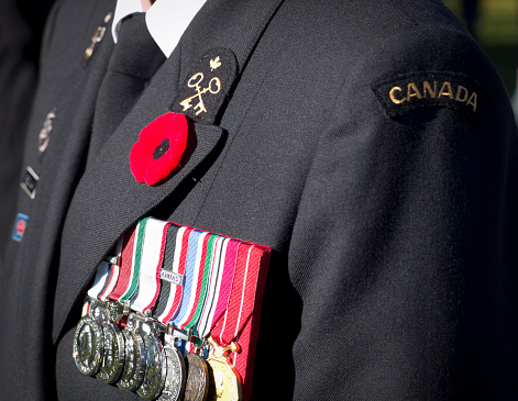 Nov 11, 2022. Calgary, Alberta, Canada. A member of the Canadian Armed Forces wearing a remembrace poppy.