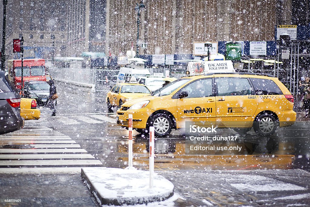 Taxi Cabs in New York "New York City, USA - January 7, 2011: Yellow Taxi cars cautiously maneuvering through a blizzard on Eight Av. Winter 2010-2011 was very snowy in New York" Architectural Feature Stock Photo