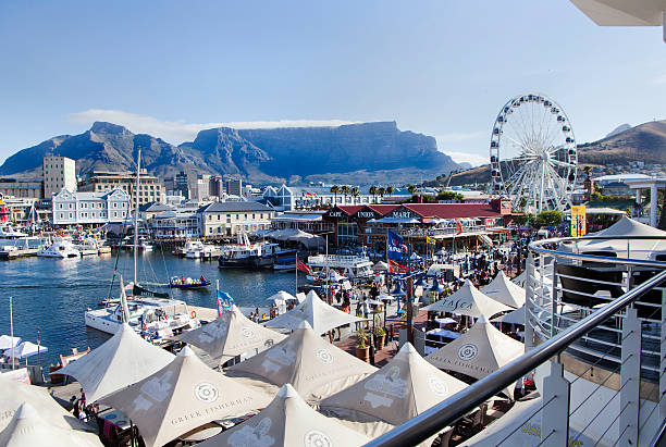 V&amp;A Waterfront, Cape Town Cape Town, South Africa - December, 31st 2011: Victoria &amp;amp; Alfred Waterfront in Cape Town, a major tourist attraction, with restaurants, hotels and a shopping mall. Table Mountain is seen in the background. cape peninsula photos stock pictures, royalty-free photos & images
