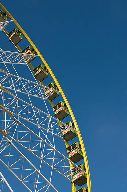 Colourful ferris wheel against a deep blue sky stock photo