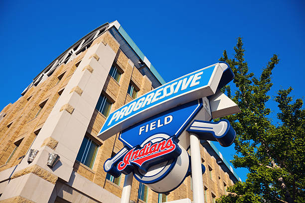 Progressive Field sign "Cleveland, Ohio, USA - August, 21 2012: Progressive Field sign in front of the stadium in the center of Cleveland. The stadium was opened in 1992 and is home to Cleveland Indians - baseball team from the Central Division of American Baseball League. The stadium currently has the capacity of 43000 people. Seen during summer afternoon." american league baseball stock pictures, royalty-free photos & images