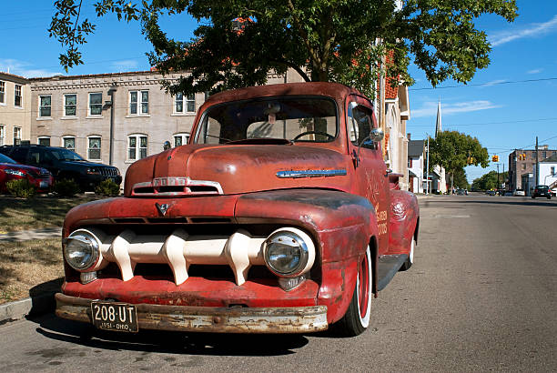 Vintage Ford F1 Truck "PIQUA, OHIO - SEPTEMBER 7, 2010: A 1952 vintage Ford F1 truck sits on a side street of the small USA town of Piqua." 1952 stock pictures, royalty-free photos & images