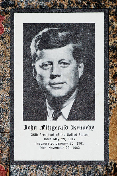 John Fitzgerald Kennedy funeral prayer obituary card Borgosesia, Italy - September 4, 2011: John Fitzgerald Kennedy funeral prayer obituary card, studio shot of the card on an old book cover. Printed by Jefferies &amp;amp;amp; Manz Inc. Phila., Pa. us president photos stock pictures, royalty-free photos & images