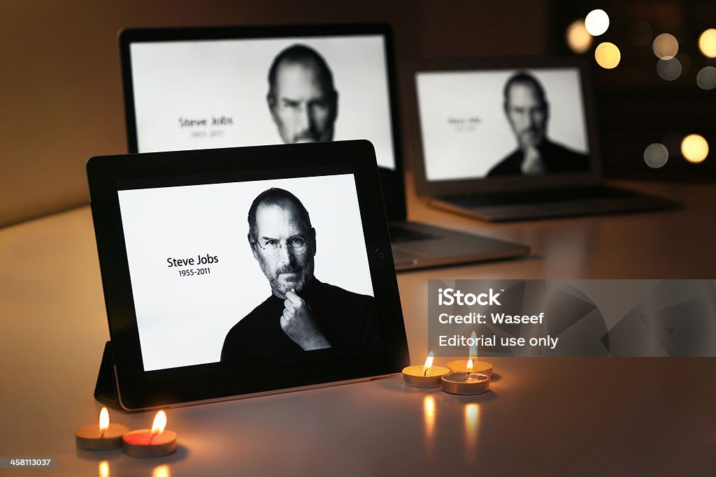 STEVE JOBS displays on Apple products "Riyadh Saudi Arabia - September 24, 2012: An iPad displays Steve Jobs, alongside candles, offer a simple goodbye to the former CEO of Apple Inc, Steve Jobs." Steve Jobs Stock Photo