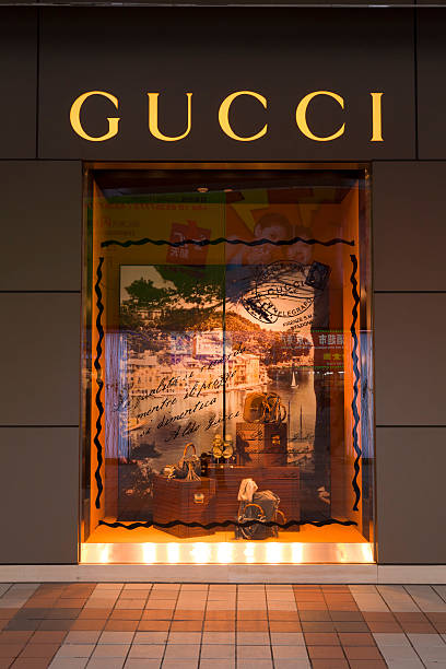 Gucci Store Beijing China "Beijing, China - March 17, 2011: Gucci store in Wangfujing Street, Beijing's most famous shopping street, China, illuminated at night." wangfujing stock pictures, royalty-free photos & images