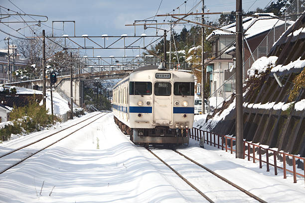 Japanese passenger train on a snowy day stock photo