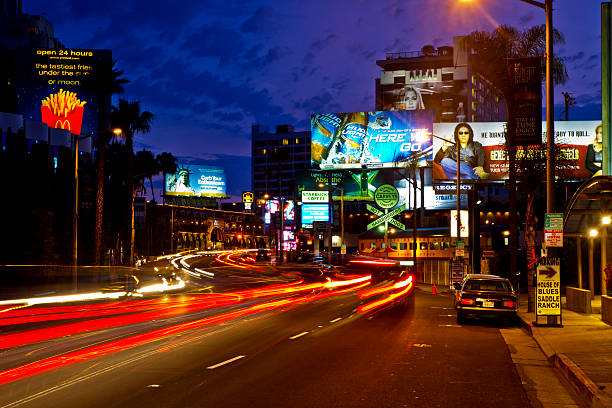 The Famous Sunset Strip in Los Angeles "Los Angeles, USA - July 5, 2011: The Sunset Strip is located in the West Hollywood area of Los Angeles and comes to life with entertainment opportunities every evening." sunset strip stock pictures, royalty-free photos & images