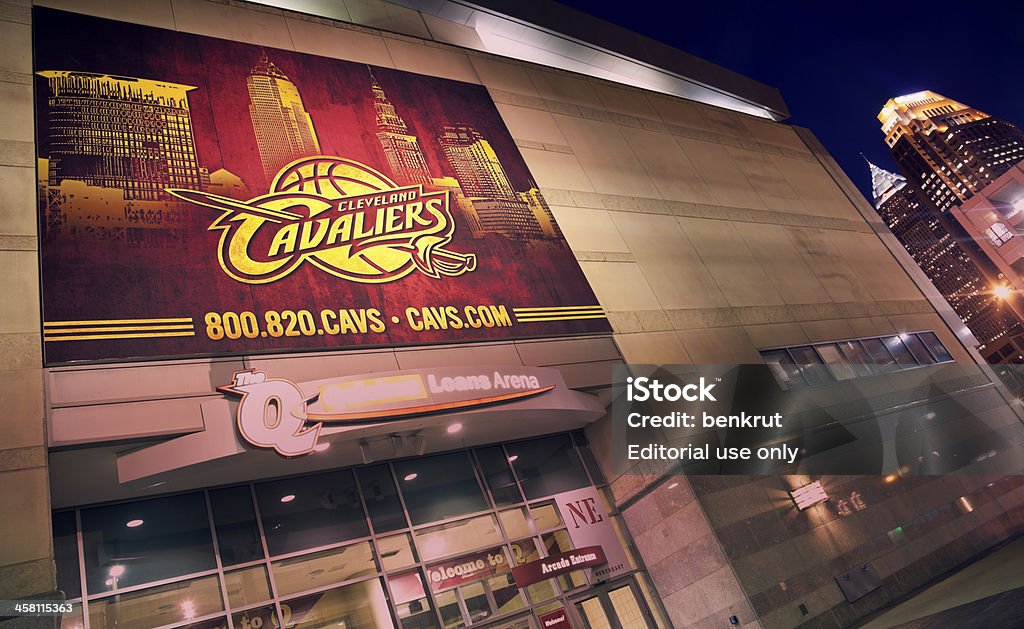Cleveland Cavaliers banner "Cleveland, Ohio, USA - August, 15 2012: Cleveland Cavaliers banner on the wall of Quicken Loans Arena in the center of Cleveland. The stadium was opened in 1994 and is home to Cleveland Cavalieres - NBA basketball team. The stadium currently has the capacity of 20000 people. Seen during summer evening with the Cleveland skyscrapers in the background." Cleveland Cavaliers Stock Photo