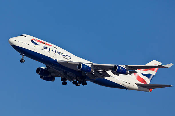 Boeing 747-400 British Airlines "New York, USA - January 23, 2011:  Boeing 747-400 climbing after take off from the JFK airport located in New York. Boeing 747-400 is one of the biggest twin jet planes using by civilian airlines and cargo companies." british airways stock pictures, royalty-free photos & images