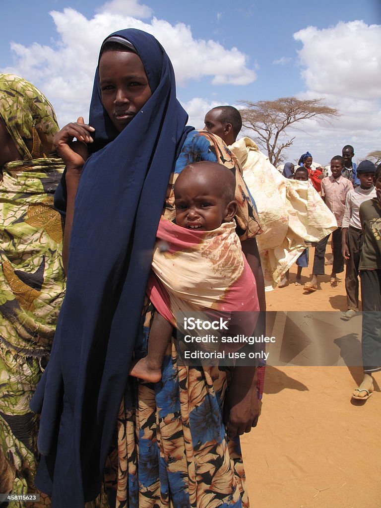 Somalian Refugee Camp "Dadaab, Somalia - August 15, 2011: Unidentified children live in the Dadaab refugee camp where thousands of Somalis wait for help because of hunger on August 15, 2011 in Dadaab, Somalia" Somalia Stock Photo