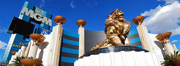Las Vegas, Nevada, USA - May 22, 2011: The massive bronze MGM Lion has a golden glow in the late afternoon sun as it overlooks the Strip in Las Vegas, Nevada.   The lion is a prominent feature of the MGM Grand Hotel and Casino complex on South Las Vegas Boulevard.