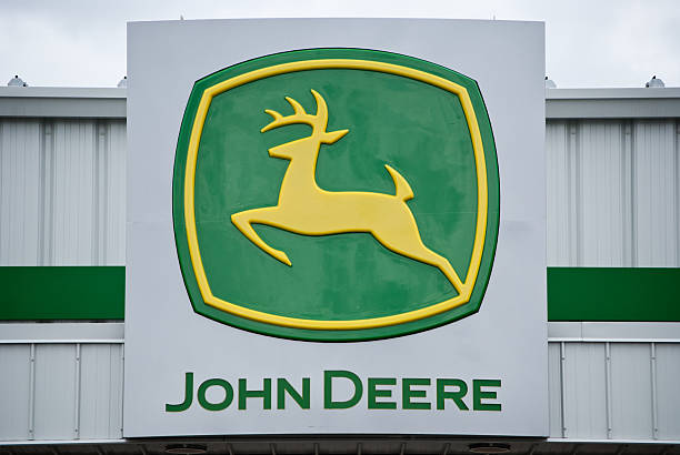 John Deere Logo Sign on a Retail Storefront stock photo