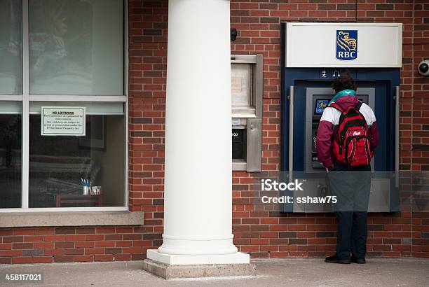 Man Using An Outdoor Rbc Atm Machine Stock Photo - Download Image Now - Bank - Financial Building, Banking, ATM