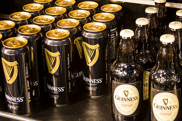 Guinness for sale "Dublin , Ireland  - May 29, 2011: Canned and bottled Guinness for sale at the Guinness brewery in Dublin Ireland. Guinness is a famous Irish beer which has been brewed in Dublin at the St James` gate brewery since 1759." guinness photos stock pictures, royalty-free photos & images