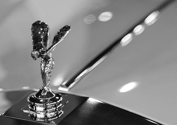 Rolls-Royce mascot "Madrid, Spain - February 25, 2012: A close up of the \""Spirit of Ecstasy\"", the hood ornament on Rolls-Royce cars." rolls royce stock pictures, royalty-free photos & images