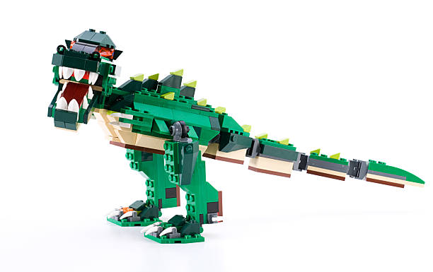 LEGO Dinosaur "Ankara, Turkey - April 04, 2012: The new LEGO Creator Ferocious Creatures kit lets little creatures (those would be your kids) build three terrifying animals. One day it's a dinosaur and the next, a crocodile. It can even become a deep-sea fish! The tail is designed to move gracefully back and forthaajust like the real thing!" coelurosauria stock pictures, royalty-free photos & images