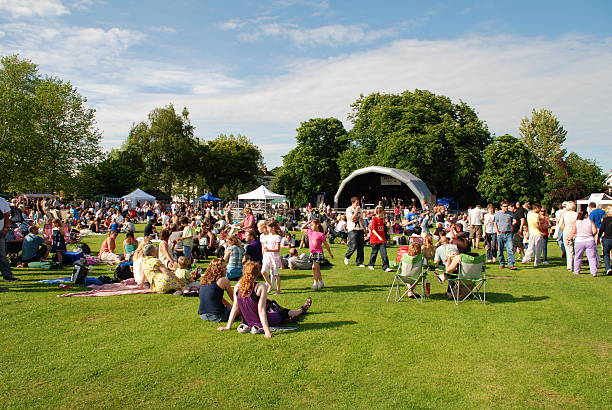 Tentertainment music festival, England "Tenterden, England - June 13, 2009: The audience watching the free local music festival at Tenterden in Kent. The annual event held in the local public park showcases local talent." music festival stock pictures, royalty-free photos & images