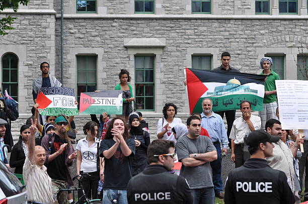 Palestinian Protest "Ottawa, Canada - June 5, 2010:  People gather to protest Israelaas presence in Gaza  after a recent attack of a Gaza flotilla." peace demonstration stock pictures, royalty-free photos & images