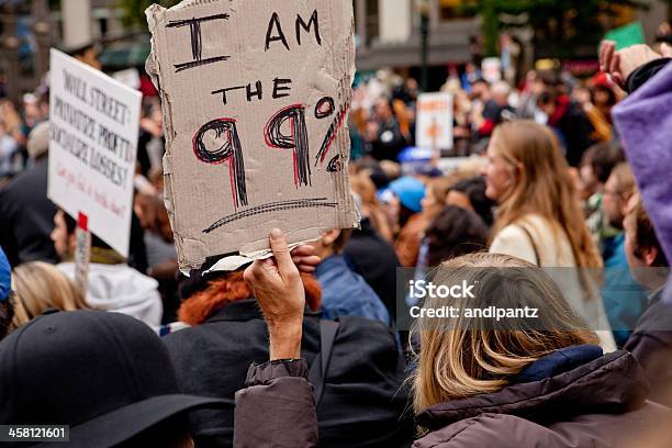 Man Holding A Sign That Says I Am The 99 Stock Photo - Download Image Now - Occupy Wall Street, 2011, Adult