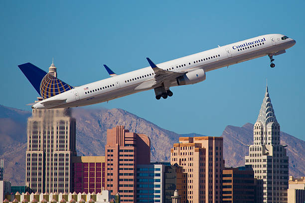 Boeing 757 of United - Continental Airline "Las Vegas, USA - November 15, 2010: Boeing 757 of United Airline weraing Continental livery, climbs after take off from McCarran International Airport located in Las Vegas, NV, USA. In the Background famous hotel New York, New York located on The Strip" boeing 757 stock pictures, royalty-free photos & images