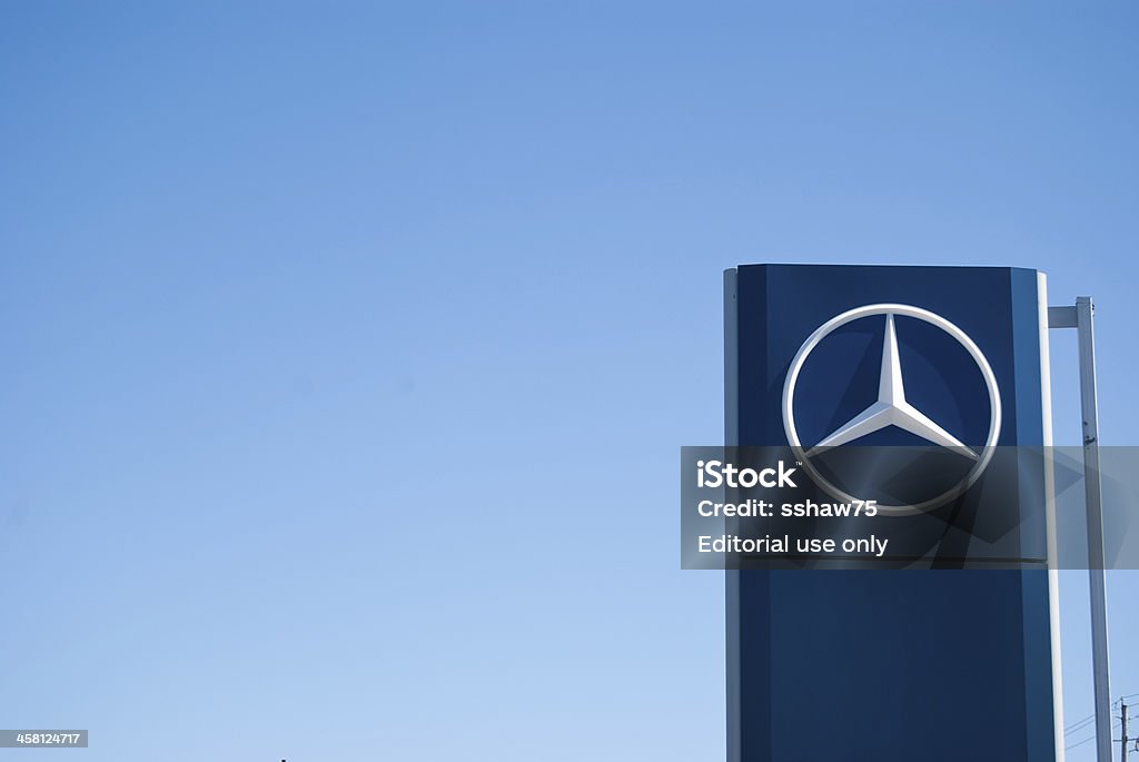 Mercedez-Benz Dealership Sign Against Clear Sky "Halifax, Nova Scotia Canada - March 27, 2011: A photograph of a large Mercedes-Benz dealership sign at a car dealership in Halifax, Nova Scotia, Canada.  The business sign contains the large iconic Mercedes-Benz 3 point star logo" Mercedes-Benz Stock Photo