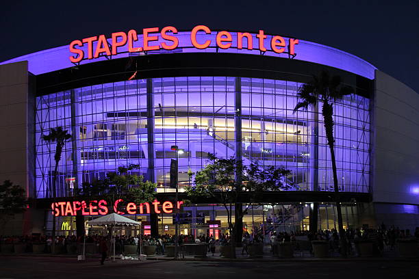 Staples Center "Los Angeles, CA, USA - August 20, 2012: A group of people gather inside the Staples Center in downtown Los Angeles for an event. Exterior photograph of the Staples Center During the early evening. Staples Center contains stadium seating for 14,000 people and houses world class sports teams such as the Los Angeles Lakers and Los Angeles Clippers." los angeles kings stock pictures, royalty-free photos & images