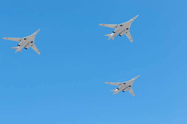 Russian air force 3 Tupolev TU-160 supersonic strategic heavy bomber "Moscow, Russia - May 9, 2010: Russian air force 3 Tupolev TU-160 supersonic strategic heavy bomber fly over the Red Square on Moscow Victory Parade of 2010" tu160 stock pictures, royalty-free photos & images