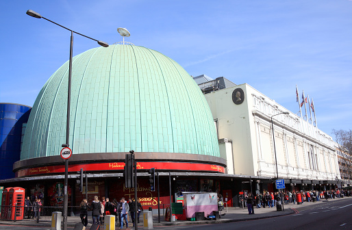 London, United Kingdom, Mar 12, 2011 : Tourists forming a large queue outside Madame Tussauds to see the exhibitions at the waxworks and planetarium