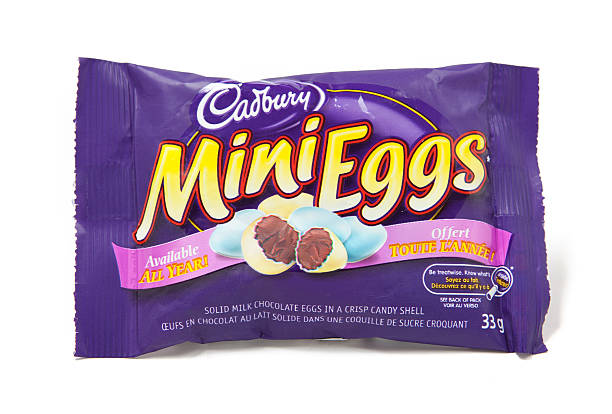 Mini Eggs Chocolate Candy "Toronto, Canada - May 8, 2012: This is a studio shot of Mini Eggs chocolate candy made by Cadbury isolated on a white background." cadbury plc photos stock pictures, royalty-free photos & images