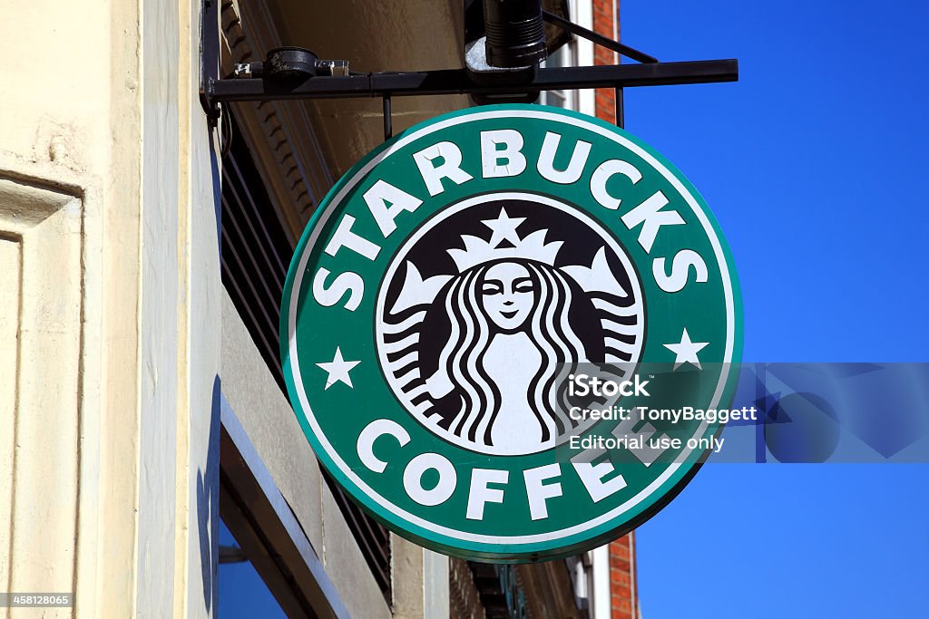 Starbucks Coffee Logo Sign London, United Kingdom - April 9, 2011: Starbucks green logo advertising sign hanging outside one of its coffee houses Starbucks Stock Photo