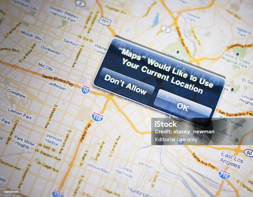 iPad 2 Maps App Location Service "Milton, Canada - June 23, 2011: iPad 2 Maps app location services dialogue box; ""Don't Allow""  or ""OK"" options displayed. Map of Los Angeles displayed on the screen." Big Tech Stock Photo