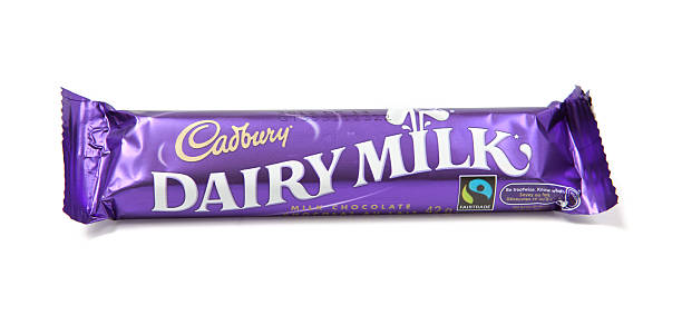 Dairy Milk Chocolate Candy Bar "Toronto, Canada - May 8, 2012: This is a studio shot of Dairy Milk chocolate candy bar made by Cadbury isolated on a white background." cadbury plc photos stock pictures, royalty-free photos & images