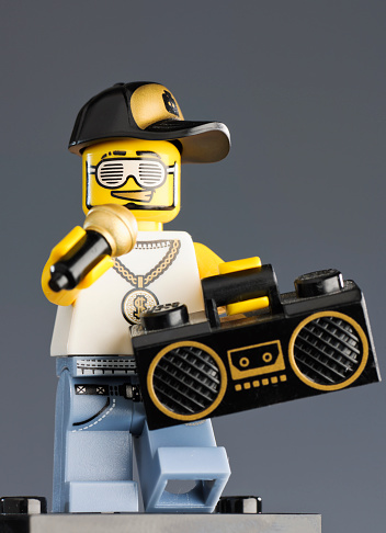 Edinburgh, UK - October 10, 2011: Close-up of a Lego rapper figure from the company's minifigures series, complete with microphone and ghetto blaster accessories.  Lego toys are produced by the Danish company Lego Group.